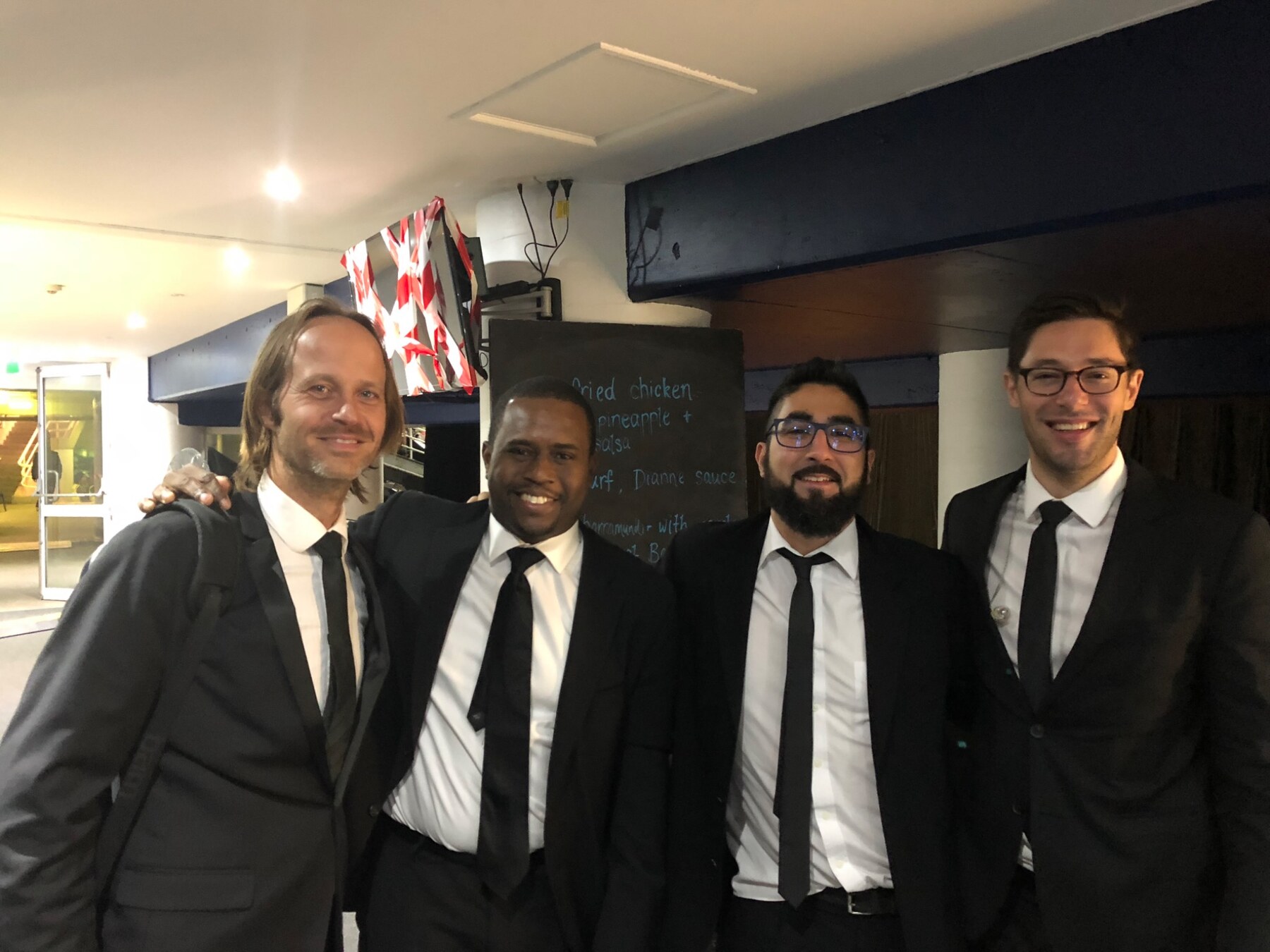 Remco Keijzer with fellow musicians in formal concert attire